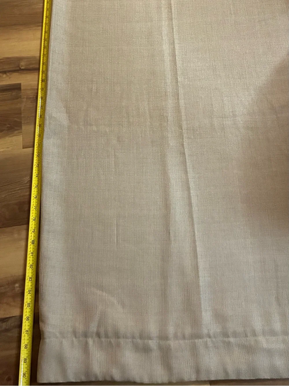 Tan grommet-top curtain panel measures approximately 90 in length 50 width. EUC